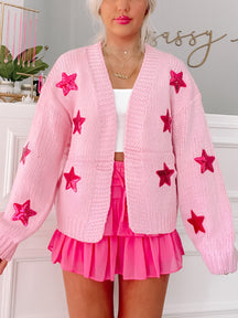Pink Sassy Stars cardigan with sparkly star accents

