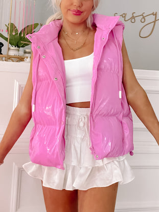 Bubblegum Bop pink puffer vest: shiny, sleeveless, casual style.
