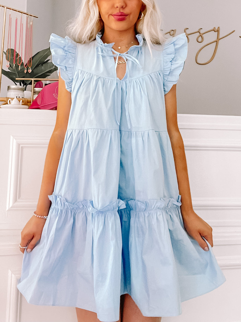Light blue tiered ruffle mini dress; perfect for summer.
