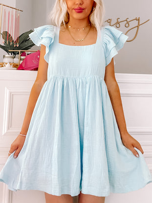 Light blue Blissfully Blue dress with ruffled sleeves; perfect summer dress.
