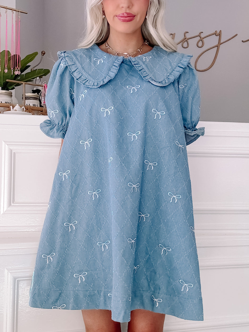 Denim Doll Dress: Light blue denim mini dress with Peter Pan collar and embroidered bows.
