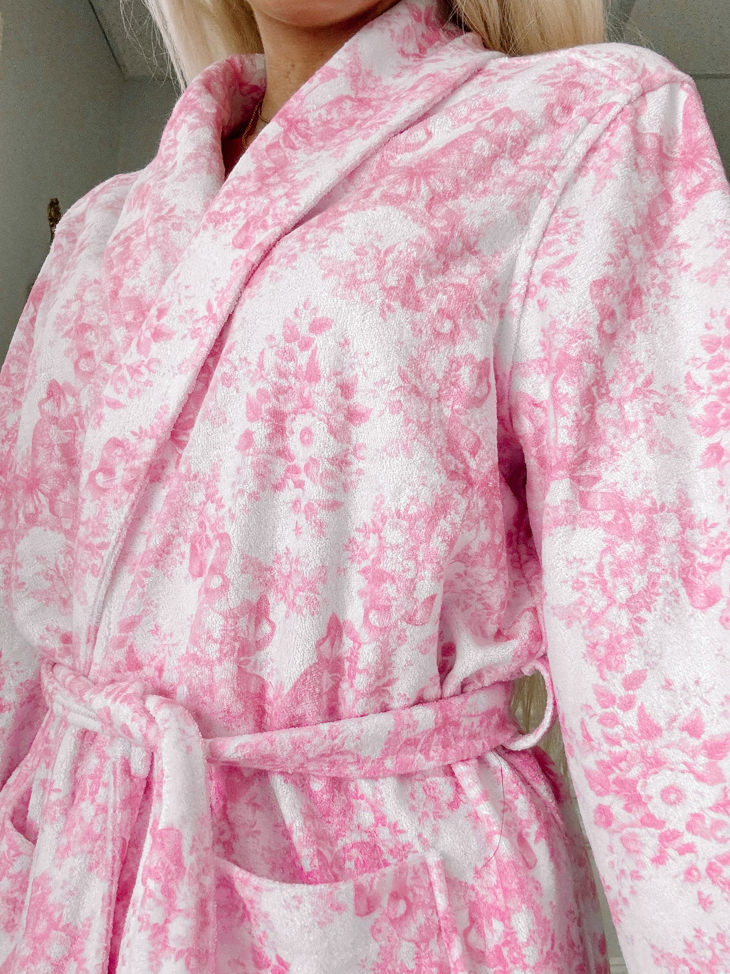 close up of pink floral robe 