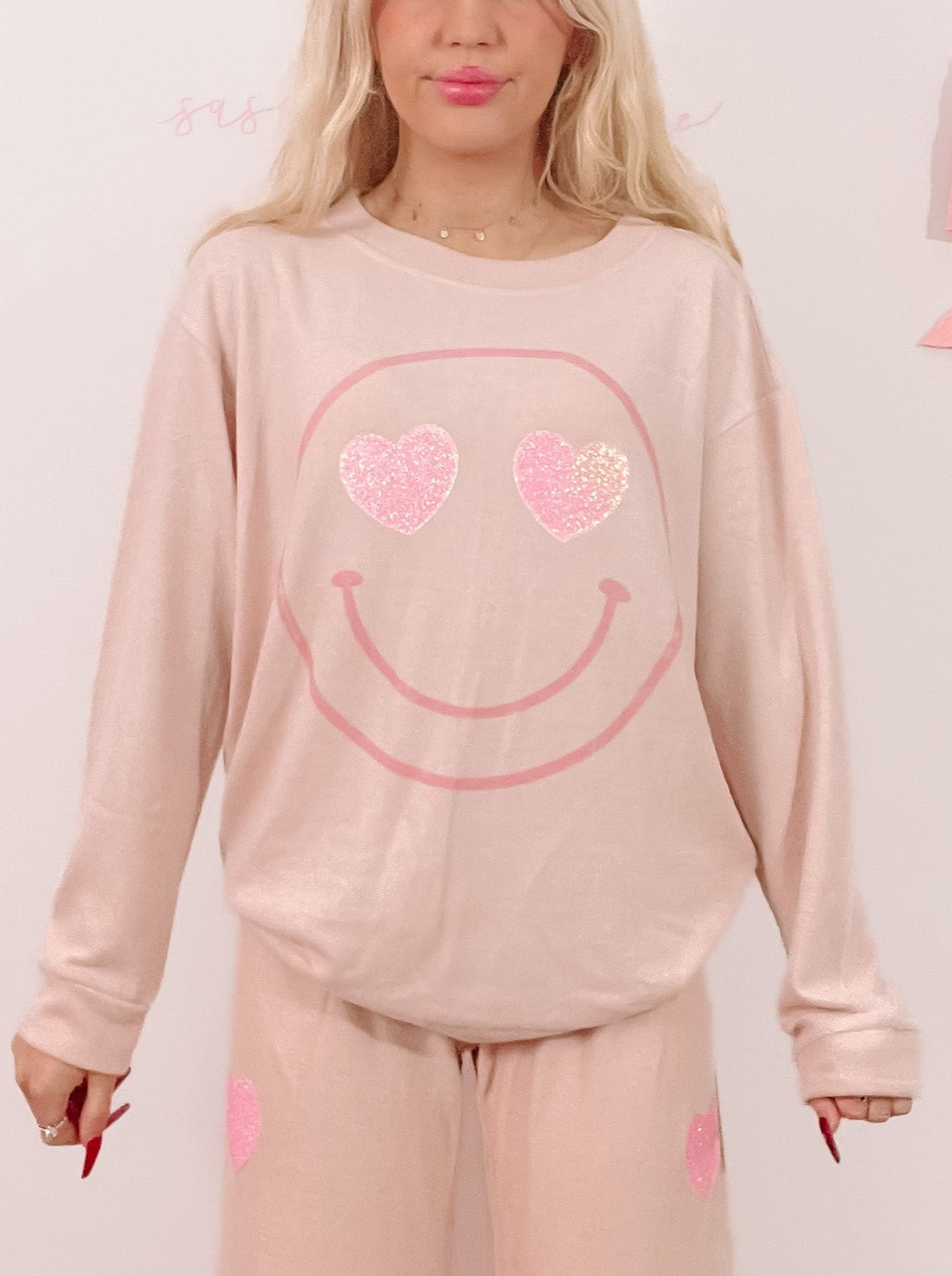 Pink sparkly heart smiley face pajama set; comfy lounge pants & sweatshirt.
