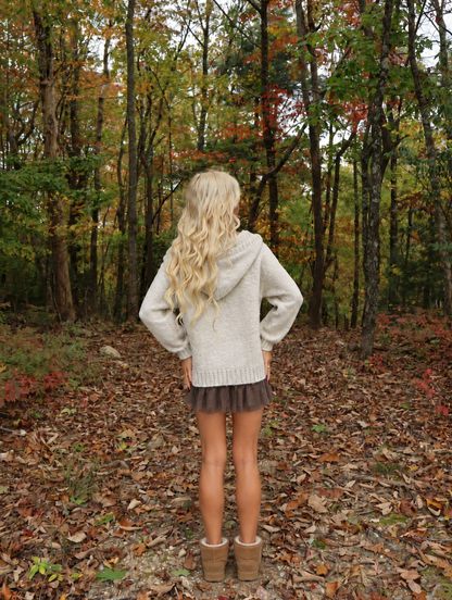 Back view of the Mocha Ribbon Hoodie Sweater by Sassy Shortcake showing the knit hood, dropped shoulders, and ribbed hem.
