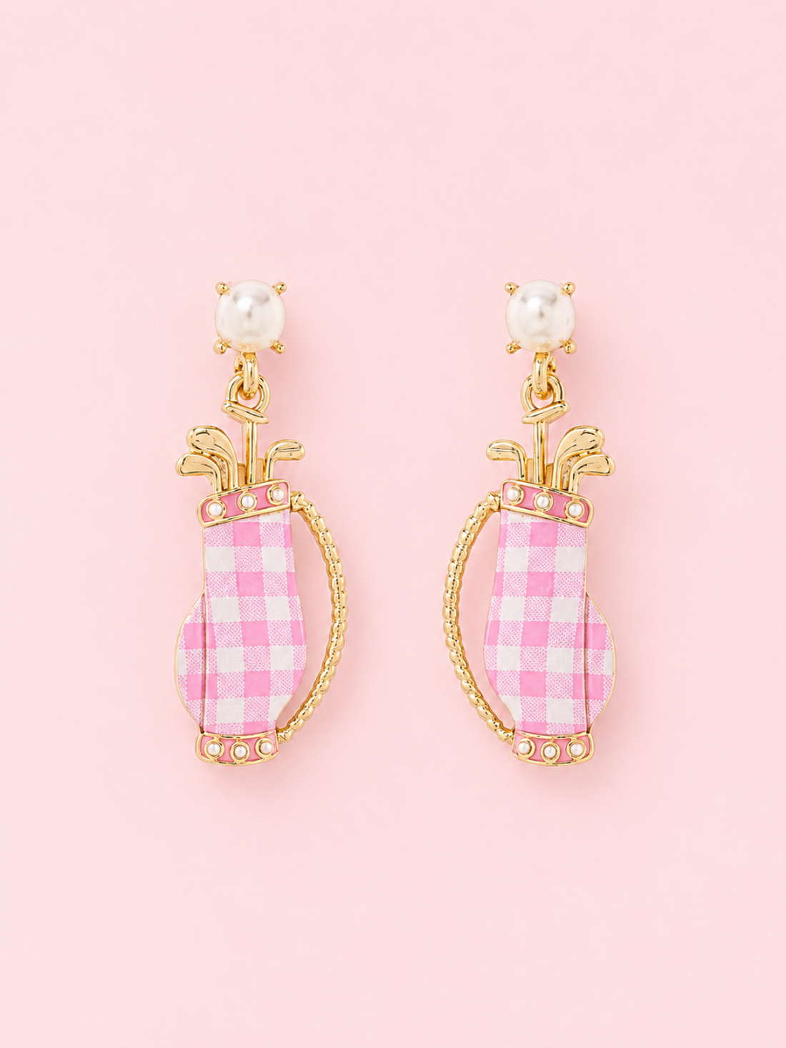 Par-Tee in Pink Earrings from Sassy Shortcake: Pink color coated golf bag earrings with gold metal details, faux pearl studs, and tiny golf club accents on a light pink background.