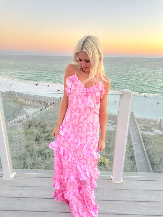 Pink tiered maxi dress on a balcony overlooking the ocean at sunset - Petal and Bow Maxi Dress from Sassy Shortcake