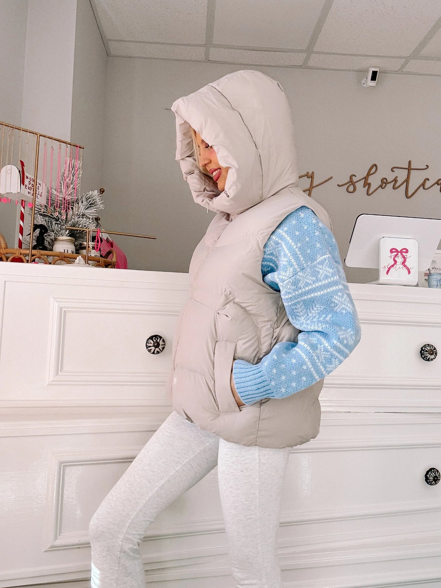 Powder Peaks Vest - Sassy Shortcake - side view of hooded puffer vest with hands in pockets