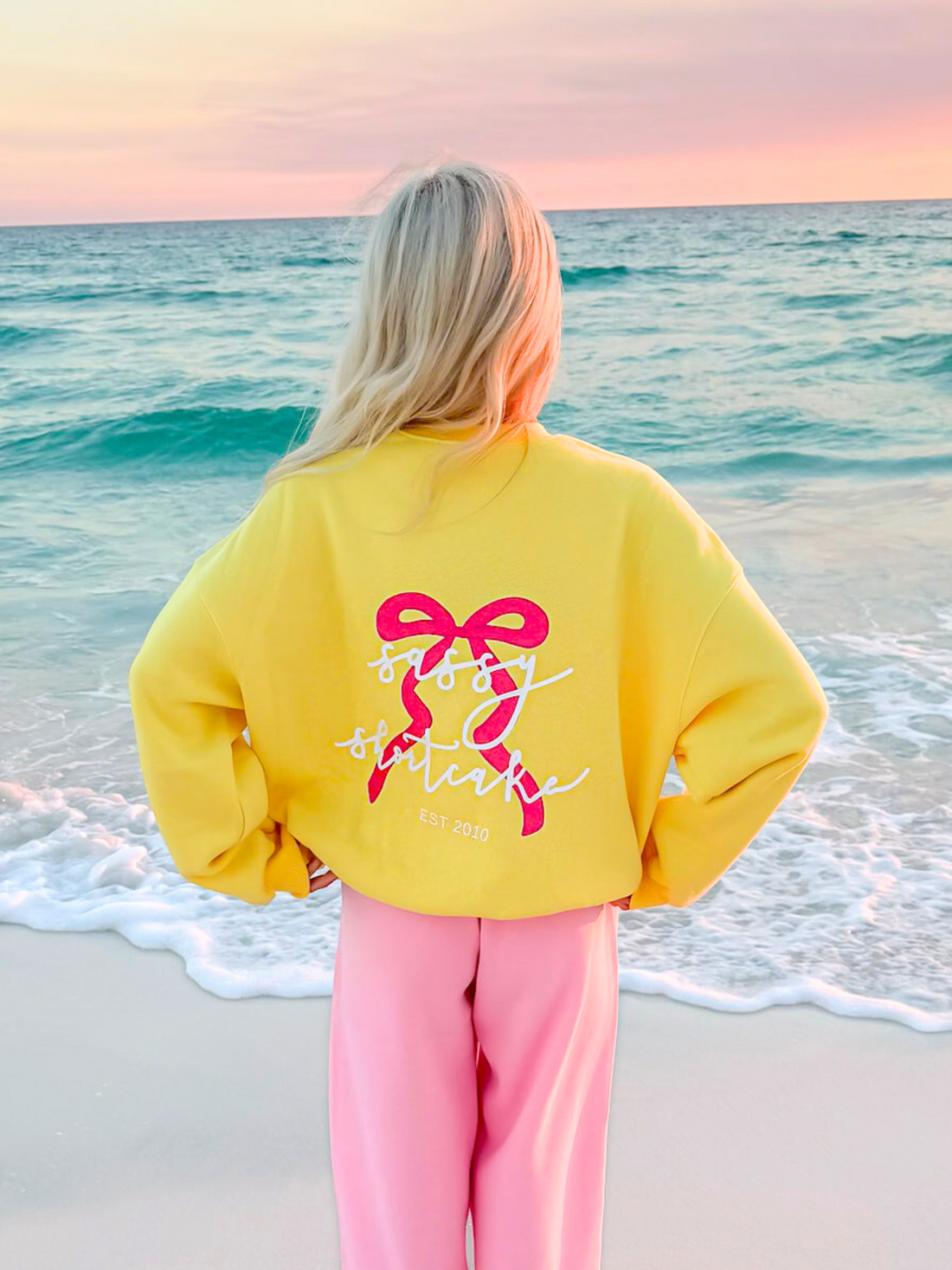 yellow crewneck with pink bow