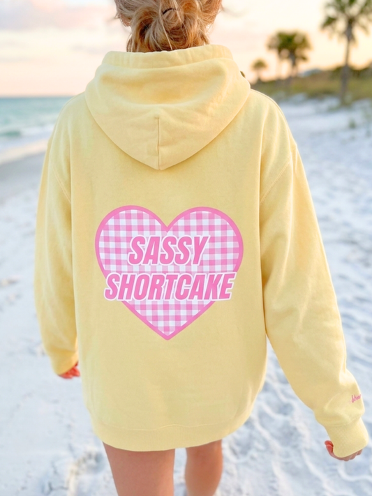 Sassy Sun Love Hoodie from Sassy Shortcake - girl wearing yellow hoodie on the beach.