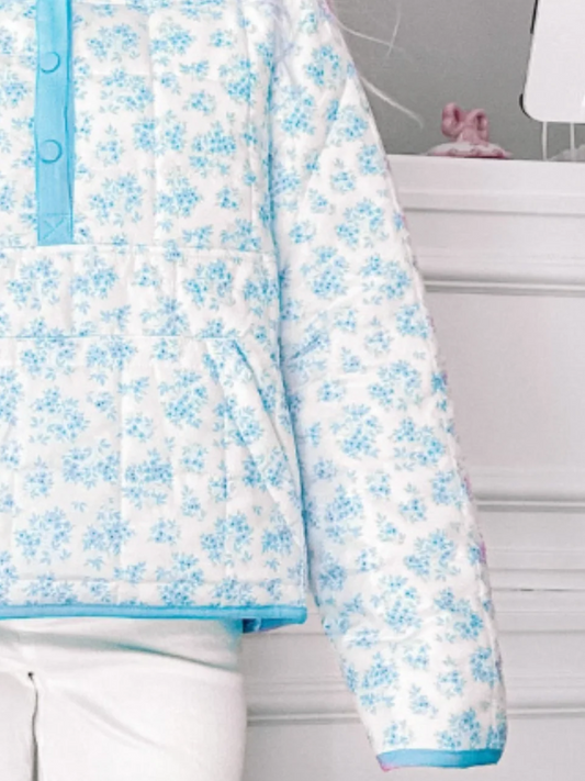 Floral Quilted Blue Pullover from Sassy Shortcake - close up of light blue floral jacket 