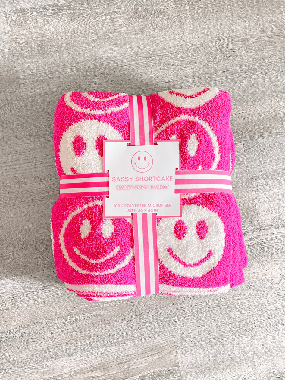 Pink smiley face blanket, 50x60 inches, soft microfiber.
