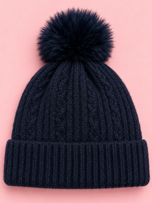 Snow Day Pom Beanie in Navy from Sassy Shortcake, a navy cable knit beanie with a ribbed fold-over cuff and a fluffy navy pom pom.