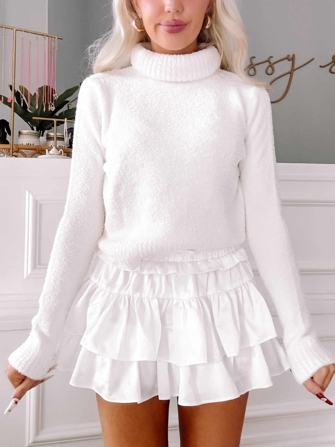 White Snuggle Up turtleneck sweater; cozy, fluffy texture.

