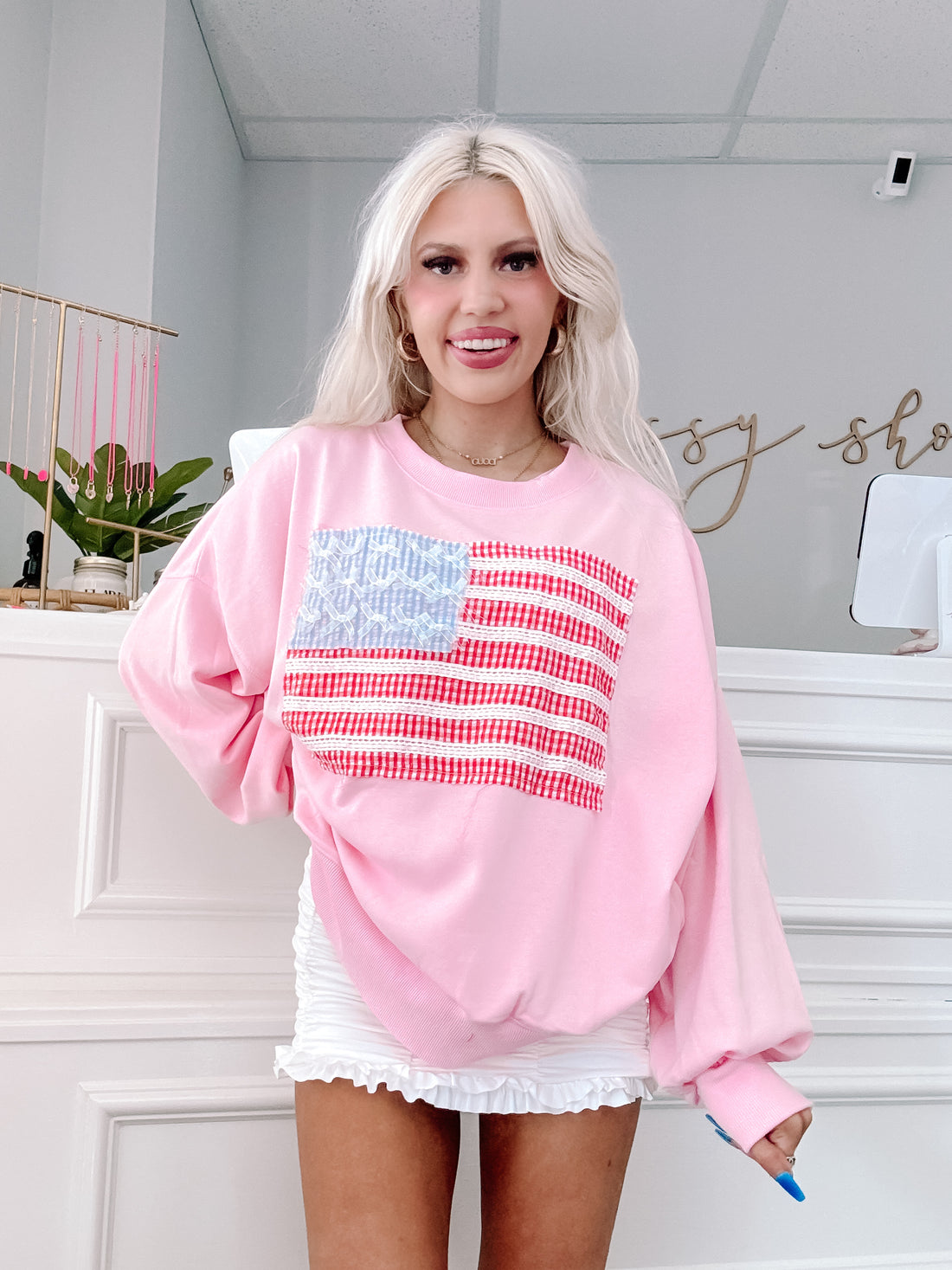 Girly pink sweatshirt styled for Fourth of July or casual cozy looks.