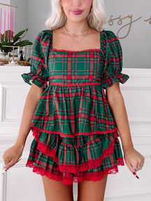 Tinsel Tartan Top: Festive green & red plaid top with ruffled hem & lace trim.
