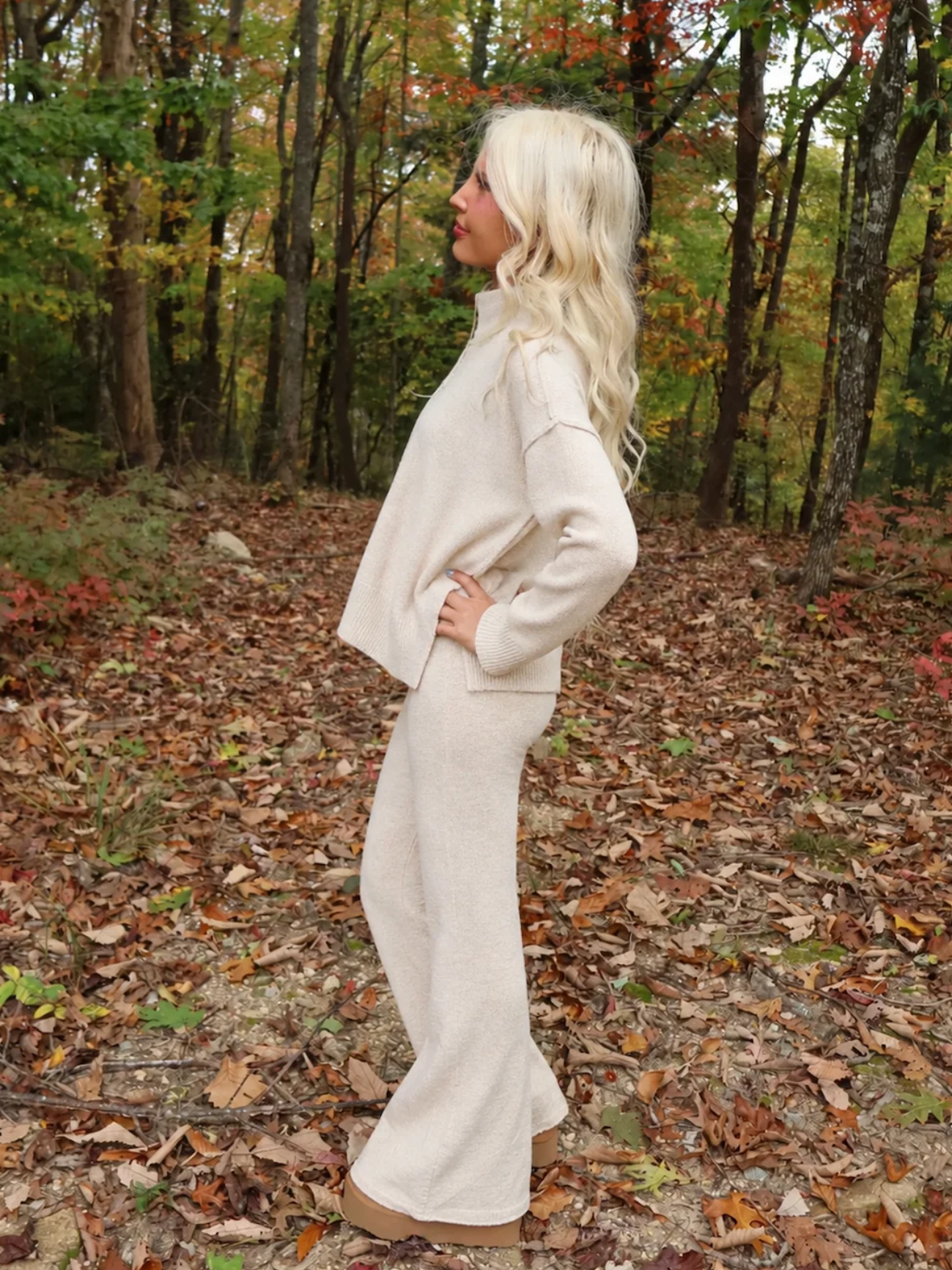 Model wearing the Toasted Almond Knit Set from Sassy Shortcake, an oatmeal mock neck sweater and wide-leg knit pants matching set, styled for fall.