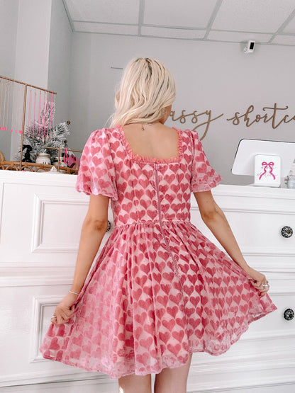Velvet Vow Heart Dress by Sassy Shortcake back view photo of heart print dress with puff sleeves
