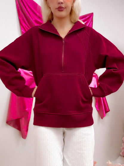 model wearing burgundy pullover with half zip