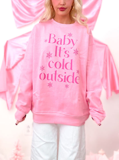 Winter pink crewneck sweatshirt with a hot pink graphic design and soft internal fleece lining, modeled on figure.