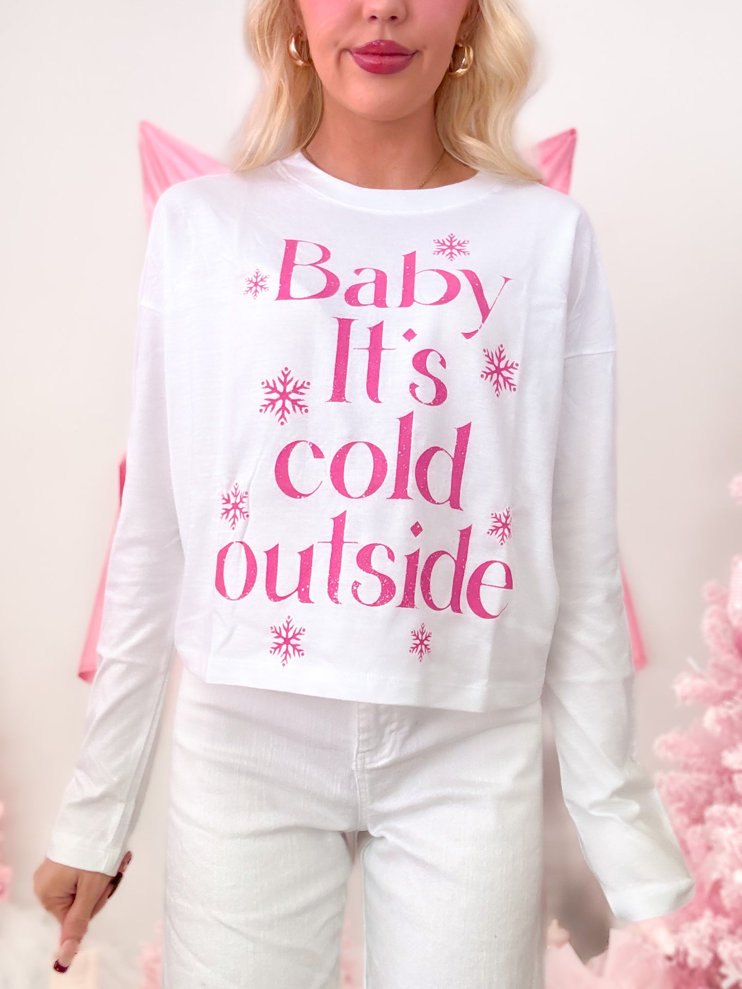 Sassy Shortcake Cold Outside Tee, a winter white t-shirt with "Baby It's Cold Outside" text and snowflakes in hot pink on the front.