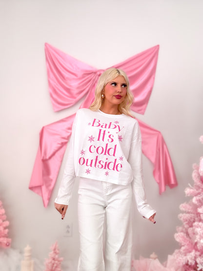 Close-up of the front of the Cold Outside Tee, showing hot pink text and snowflake print on a white background.
