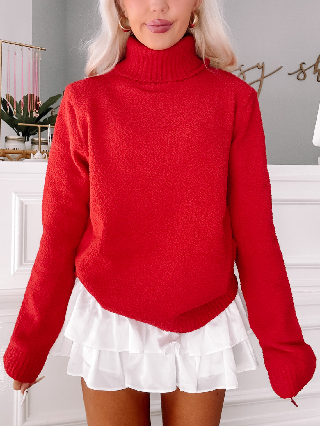 Blush & Berry red turtleneck sweater, cozy knit fabric.
