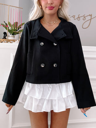 Black cropped double-breasted coat with ruffle detail
