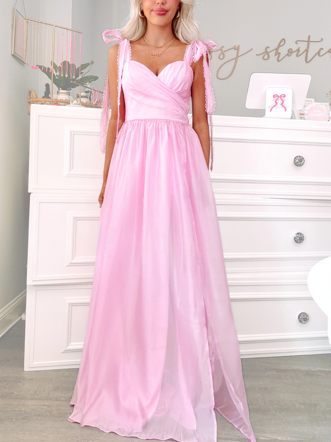 Back of blush pink party dress showing exposed zipper and strapless sweetheart neckline