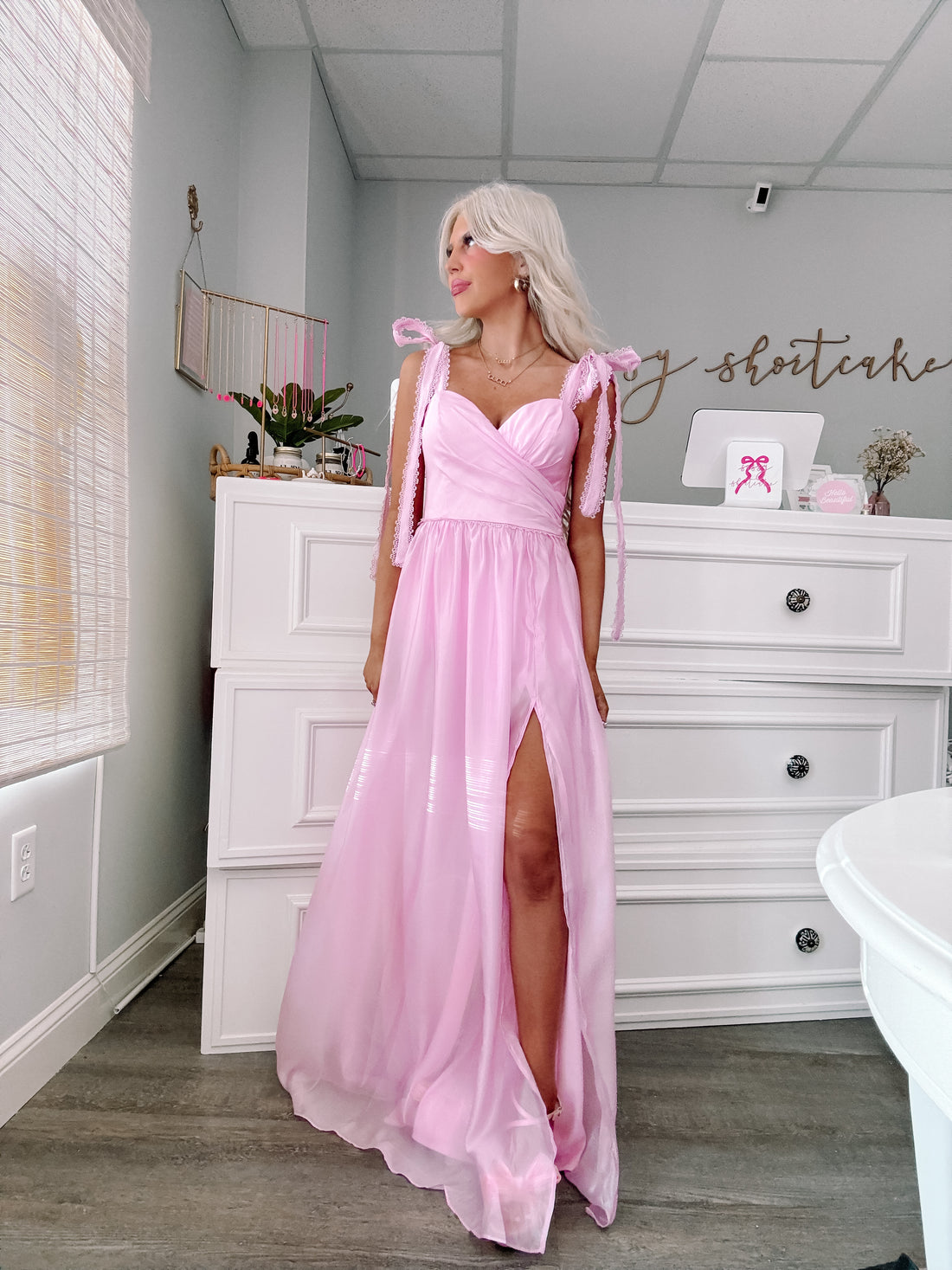 Detail of blush pink tulle dress from sassy shortcake with soft layered ruffles and a structured bodice.