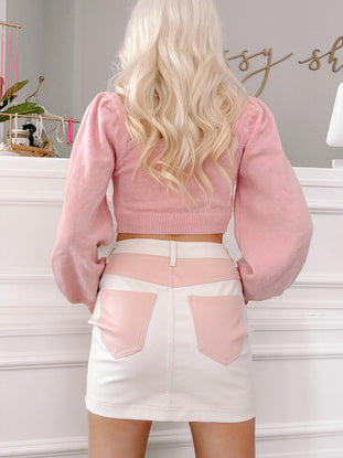 Blush Harmony skirt:  off-white mini skirt with pink leather accents.

