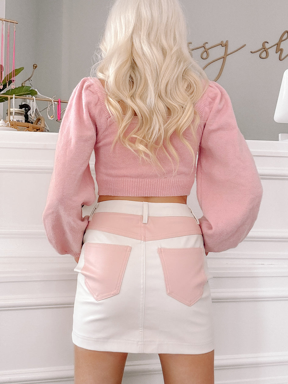 Blush Harmony skirt:  off-white mini skirt with pink leather accents.
