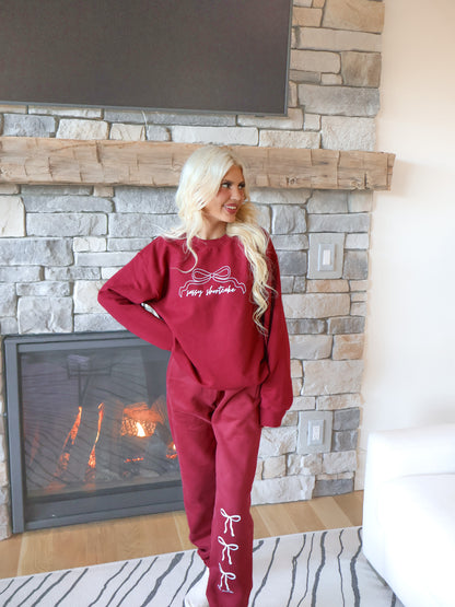 Super cute burgundy sweatpants with white bow and Sassy Shortcake logo graphic, designed for comfort with micro-fleece lining.