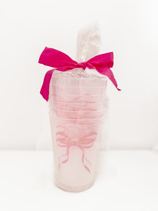 Pink Bow Cups: Set of frosted pink cups with pink ribbon accents, perfect for parties.
