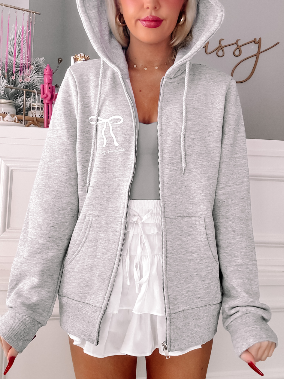 Grey Sassy Shortcake Sassy Bow Zip Up hoodie featuring a cute bow detail.
