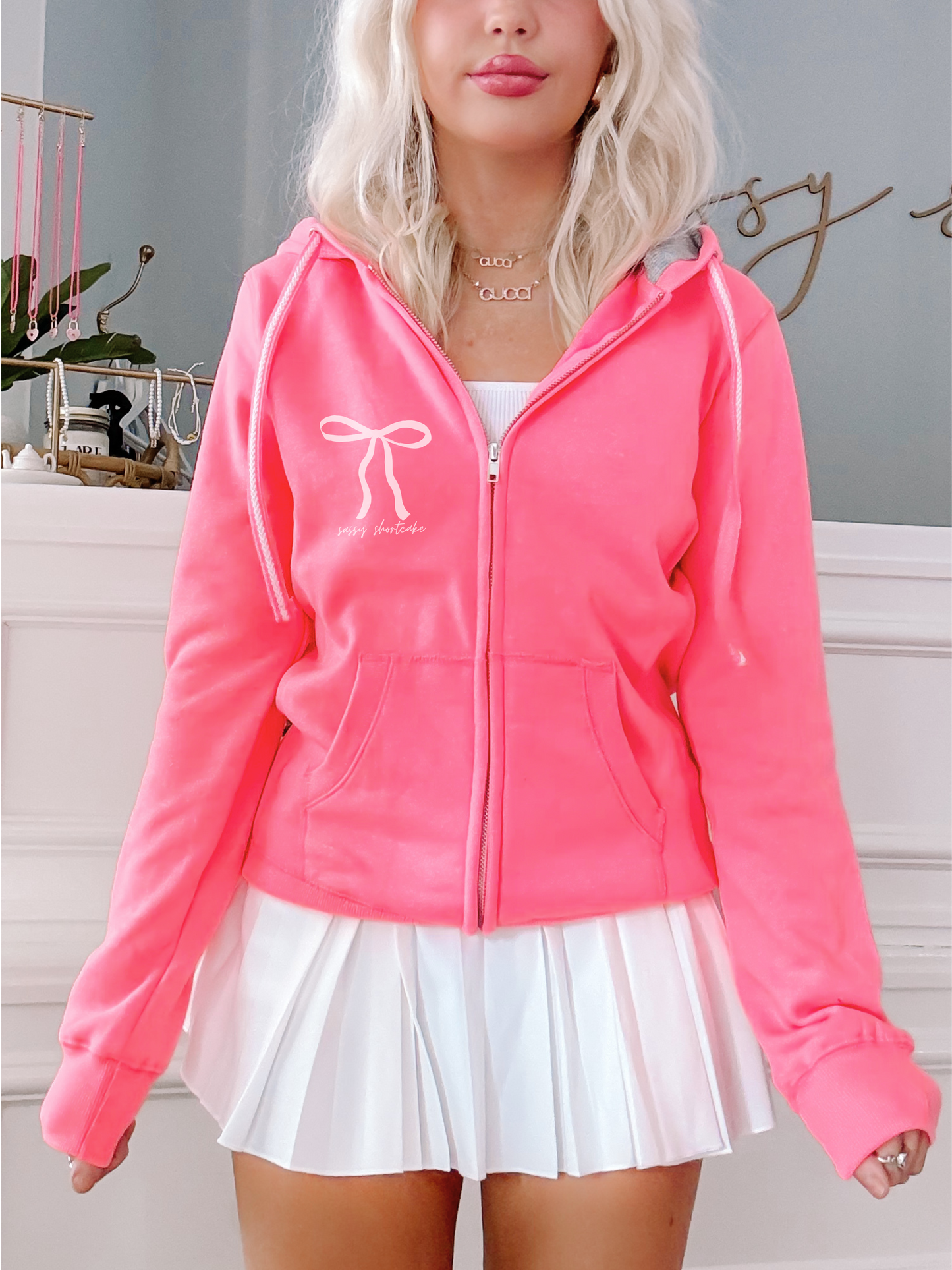 Neon pink Bow Zip Up hoodie by Sassy Shortcake; features a cute bow graphic.
