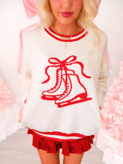 Sassy Shortcake Bows on Ice Sweater; festive bow and skate graphic.