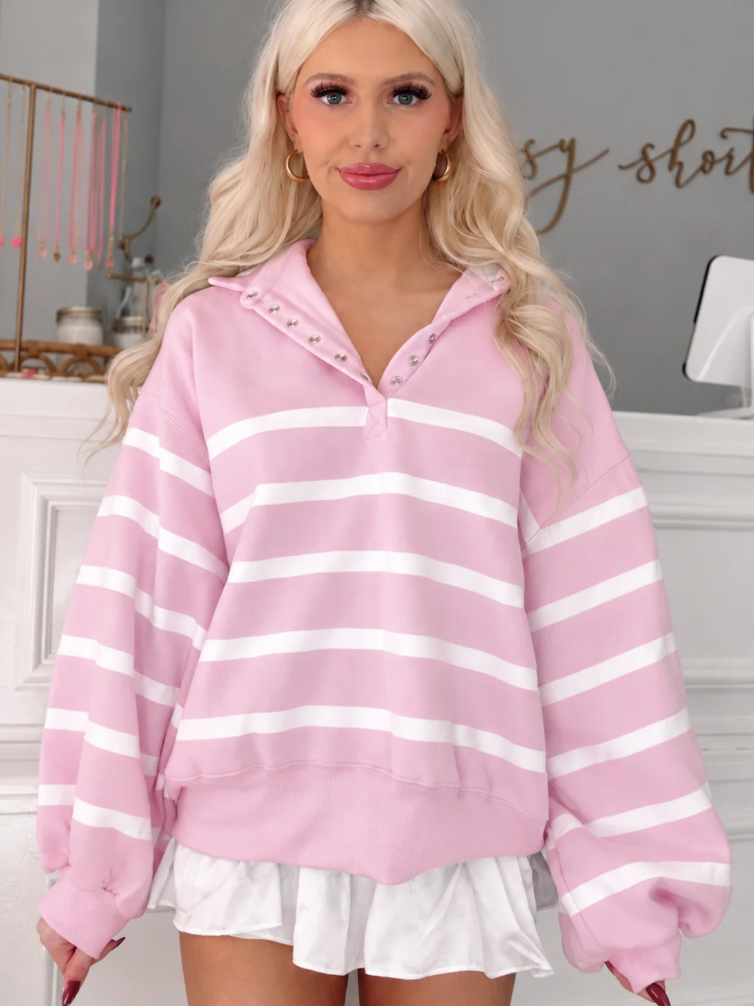 Front view of the Brynn Baby Pink Stripe Pullover, an oversized pink and white striped sweatshirt with a snap-button collar from Sassy Shortcake