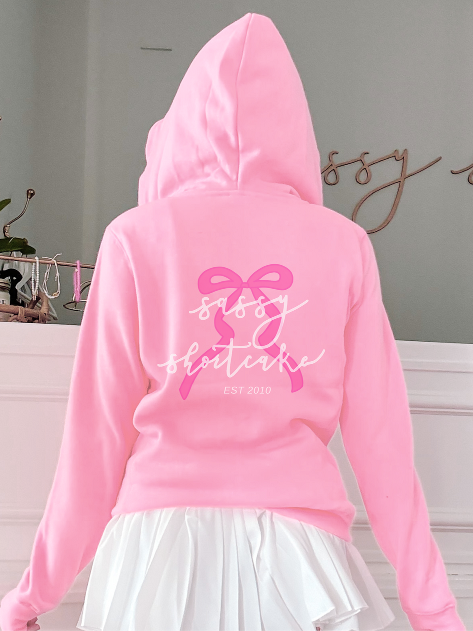Pink Sassy Shortcake Bubblegum Bowquette Hoodie with pink bow design
