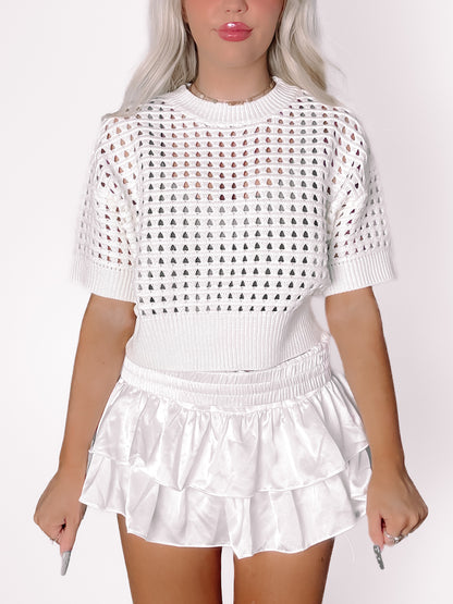 White Carson Crochet short-sleeve crop top with unique heart-shaped cutouts.
