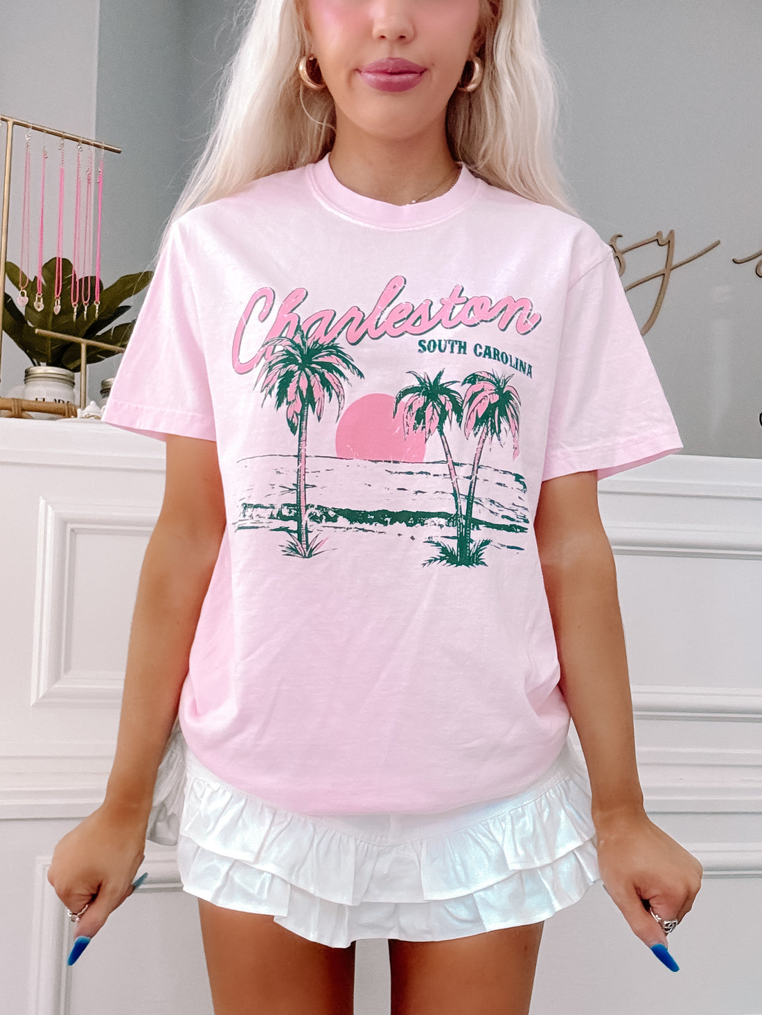 Coastal-inspired pink t-shirt styled for sunny days.