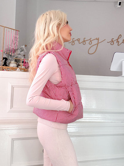 Cherry Picking Vest by Sassy Shortcake  - Woman wearing a red checkered vest over a pink shirt.