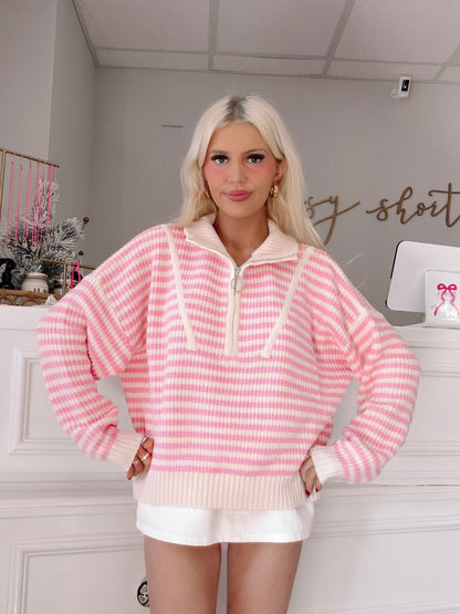 Cozy By The Coast Pullover from Sassy Shortcake - Person wearing a pink and white striped sweater.