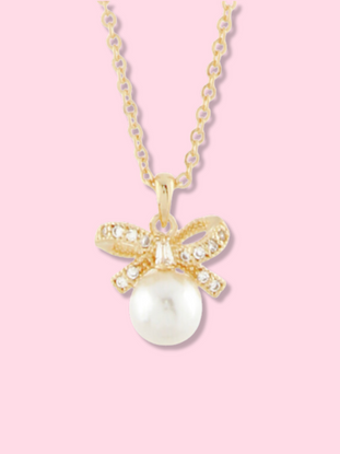Gold Dainty Darling Bow Necklace with pearl and cubic zirconia accents.
