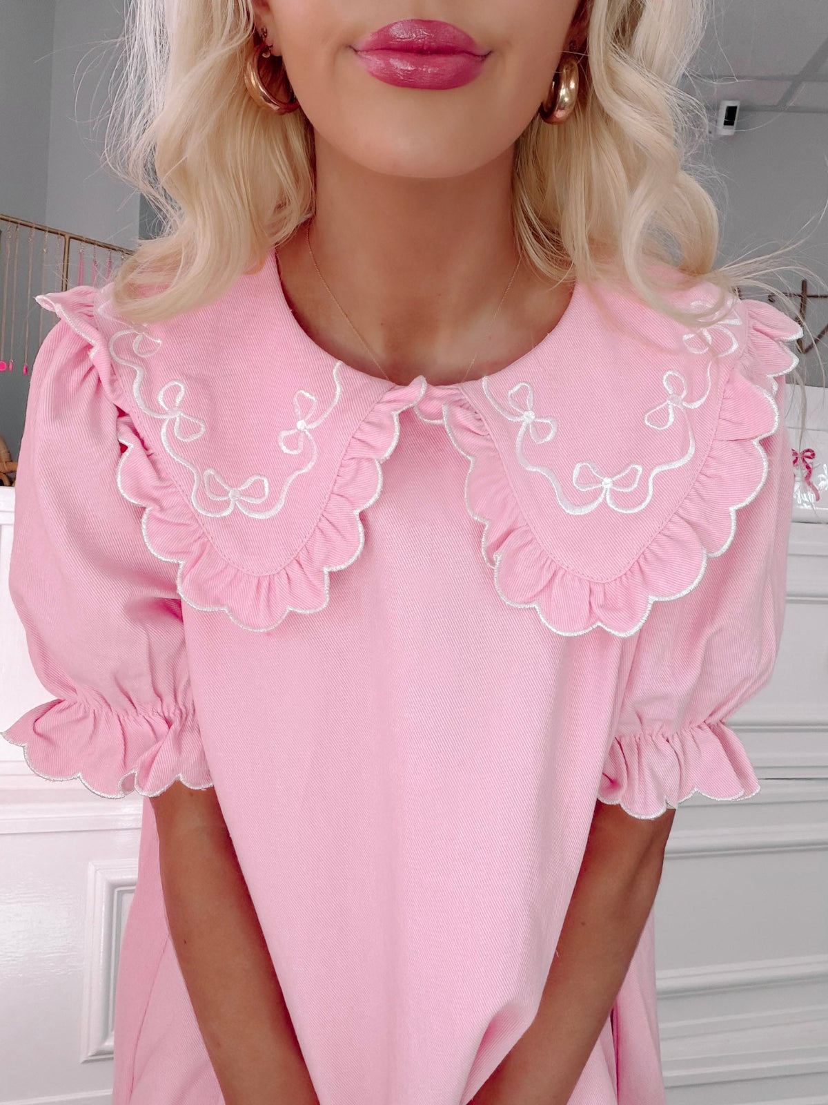 Denim Doll Pink Dress from Sassy Shortcake - Person wearing a pink dress with ruffled collar and sleeves.