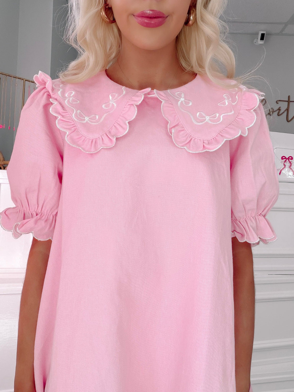 Denim Doll Pink Dress from Sassy Shortcake - Pink dress with ruffled collar worn by a person indoors.