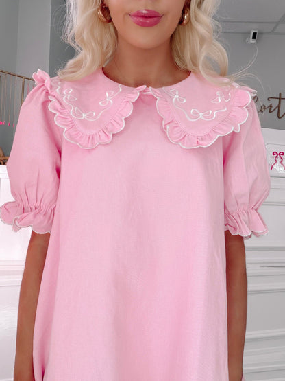 Denim Doll Pink Dress from Sassy Shortcake - Pink dress with ruffled collar worn by a person indoors.