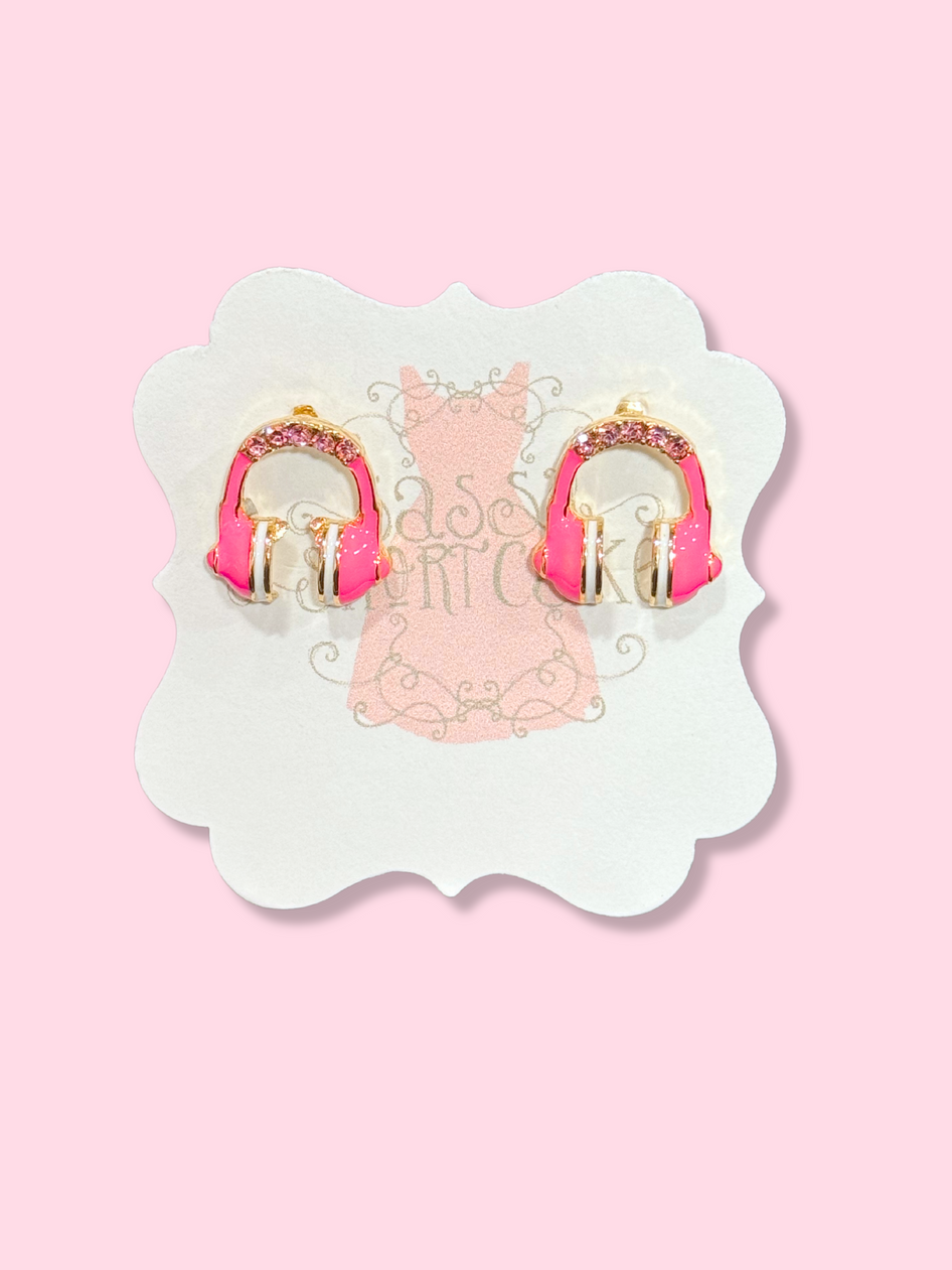 Pink earmuff earrings with gold accents and crystal detailing.
