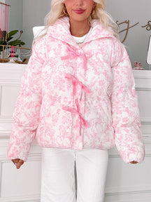Fairytale Bow Jacket by Sassy Shortcake in ivory quilted floral with pink bow-tie zipper detail