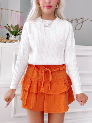 Orange linen ruffle mini skirt with drawstring waist
