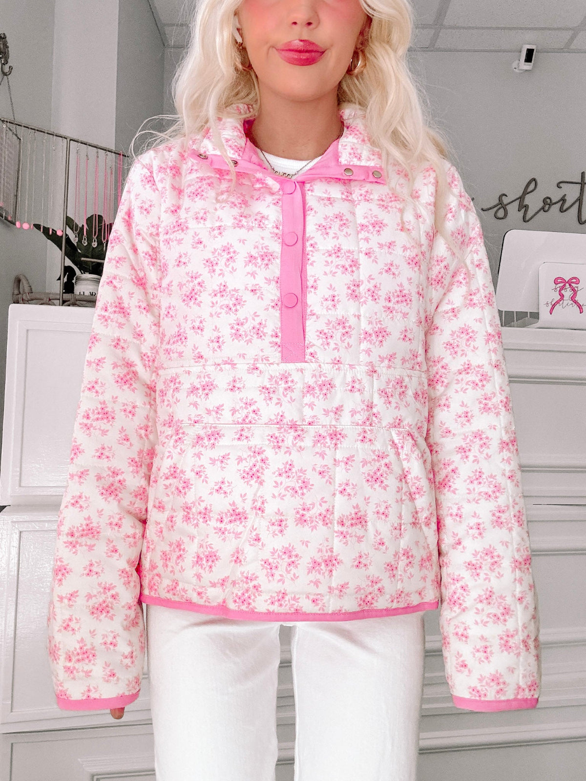 Floral Quilted Pullover from Sassy Shortcake - Person wearing a pink floral pullover in an indoor setting